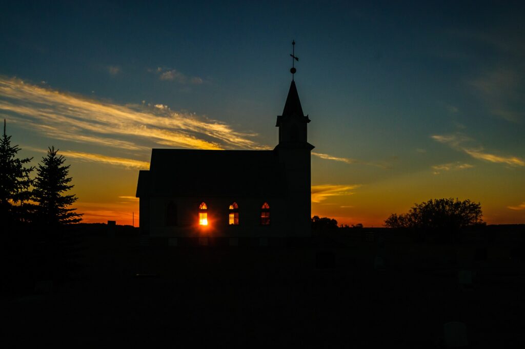 Church silhouetted against the evening sky at Spring Creek